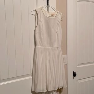 Erin Featherstone White Sleeveless Faux Leather top with silky bottom.